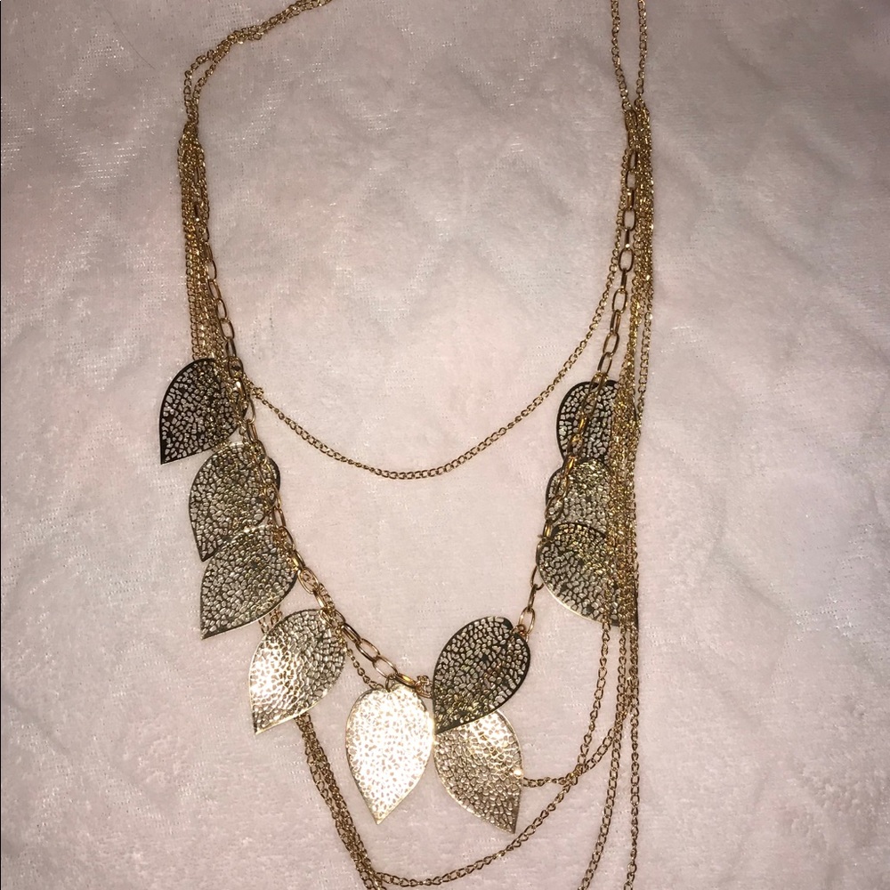 Gold tone leaf layering necklace.